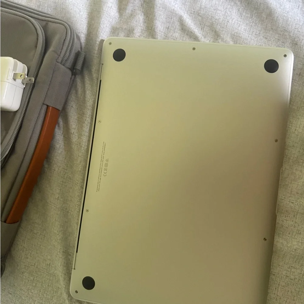 Apple Laptop with Red Logo and Silver Body